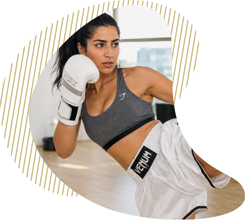 A member training on the bag in the fitness room